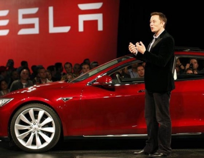 Tesla Reports Record Profit But Cuts Prices